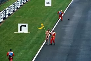 Images Dated 23rd July 2003: Formula One World Championship: A streaker runs down the pit straight at Silverstone