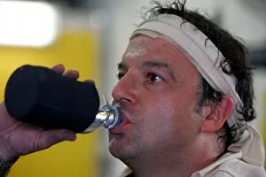 Images Dated 28th July 2005: Formula One World Championship: A very sweaty Jordan mechanic