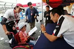 Images Dated 7th October 2004: Formula One World Championship: Takuma Sato BAR signs autographs for the fans