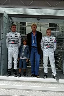 Images Dated 23rd June 2002: Formula One World Championship: Tennis legend Boris Becker and son are flanked by David Coulthard