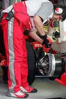 Formula One World Championship: A Toyota mechanic works on the car