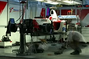 Images Dated 3rd April 2004: Formula One World Championship: Toyota mechanics work on the cars in the garage into the night