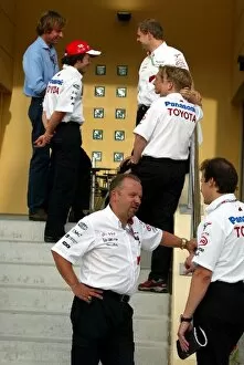 Images Dated 3rd April 2004: Formula One World Championship: Toyota personnel chat on the steps of their team offices