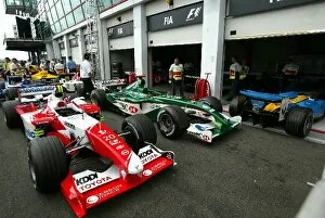 Images Dated 5th July 2003: Formula One World Championship: Toyota TF103 and Jaguar R4 in the parc ferme area