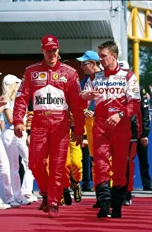 2002 Collection: Formula One World Championship: Toyotas Allan McNish, right, chats with F1 World Champion Michael