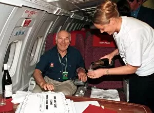 Images Dated 28th September 2001: Formula One World Championship: TV Commentator Murray Walker relaxes with a glass of champagne
