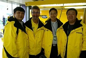 Images Dated 9th March 2003: Formula One World Championship: VIPs from the Shanghai Circuit in the Jordan pit: Yu Zhifei