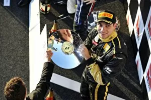 Formula One World Championship: Vitaly Petrov Lotus Renault GP celebrates his third position on the podium