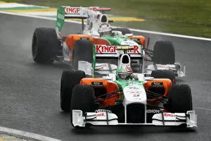 Formula One World Championship: Vitantonio Liuzzi Force India F1 VJM03 leads team mate Adrian Sutil Force India F1