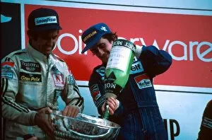 1982 Collection: Formula One World Championship: Winner Alain Prost empties the champagne into the trophy held by