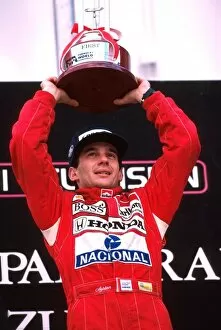 Podium Collection: Formula One World Championship: Winner Ayrton Senna celebrates his win