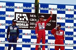 Formula One World Championship: Winner Ayrton Senna, with second place Alessandro Nannini, left