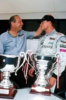 Formula One World Championship: Winner David Coulthard Mclaren MP4-15, is congratulated by Ron Dennis Mclaren Boss
