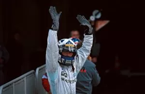 Formula One World Championship: Winner David Coulthard Mclaren MP4-15 acknowledges the cheers of the crowd