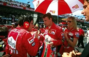 Australia Collection: Formula One World Championship: Winner Eddie Irvine Ferrari F199 on the grid before the start