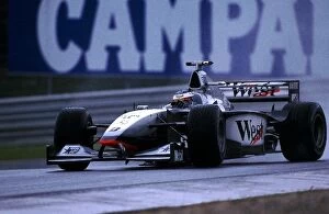 Formula One World Championship: Winner Mika Hakkinen Mclaren MP4-13 in wet practice