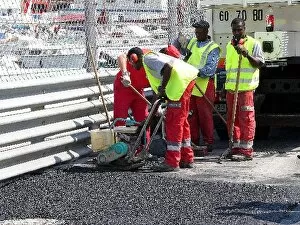 Images Dated 26th May 2004: Formula One World Championship: Workmen resurface a section of the track