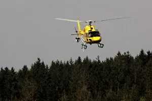 Images Dated 14th September 2007: Formula One World Championship: A yellow AS350 Squirrel helicopter