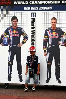 Images Dated 1st October 2009: Formula One World Championship: Young child with pictures of Mark Webber Red Bull Racing