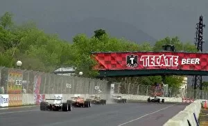 Toyota Atlantic Championship Gallery: A gaggle of midfielders make their way under the Tecate bridge and into turn one