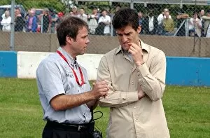 Images Dated 29th July 2003: Gerhard Ungar (GER), Chief Designer AMG, left, talking with Formula One driver Mark Webber