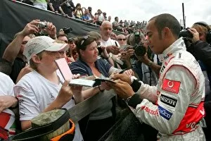 Images Dated 13th July 2008: Goodwood Festival Of Speed: Lewis Hamilton McLaren Mercedes signs autographs
