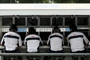 Images Dated 11th September 2009: GP2 Series: Piquet GP Team Engineers sit on the Renault F1 team pitwall gantry