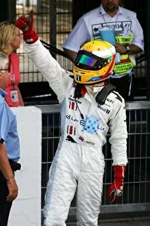 Images Dated 30th July 2006: GP2 Series: Third placed Lewis Hamilton ART Grand Prix celebrates in parc ferme