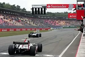 Images Dated 19th July 2008: GP2 Series: Romain Grosjean ART crosses the line to win