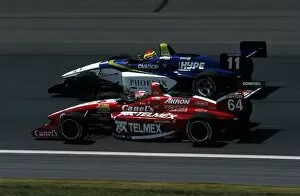 Images Dated 12th July 2001: Indy Lights Series: Kristian Kolby, car 11, overtakes Ronaldo Quintanilla, car 64
