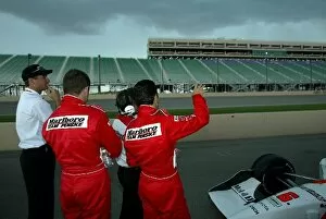 Pikes Peak International Raceway Collection: Indy Racing League: Gil de Ferran, Helio Castroneves and Tim Cindric watch the lightening