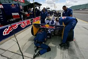 Images Dated 21st August 2005: Indy Racing League: Red Bull Cheever crew work on the car Patrick Carpentier at the Honda Indy 225