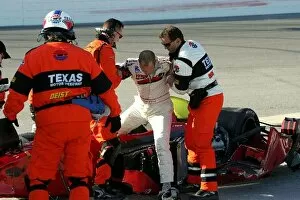 Images Dated 17th October 2004: Infiniti Pro Series: James Chesson climbs out of his mangled race car after crashing in the Texas