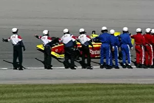 Images Dated 8th September 2003: Infiniti Pros Series: The track safety workers wish second placed Ed Carpenter A