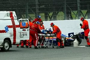 Images Dated 22nd April 2002: Jacques Lazier (USA) Johns Manville Racing is stretchered to the ambulance suffering a lower