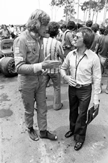 More images of Niki Lauda and James Hunt Collection: James Hunt (with holes in his boots) talks to Bernie Ecclestone