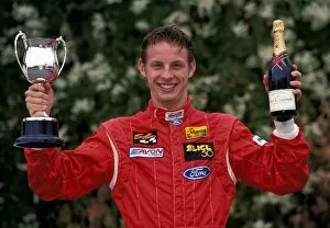 Images Dated 7th May 2004: Jenson Button Photo Shoot: Formula Ford driver Jenson Button with a trophy and champagne