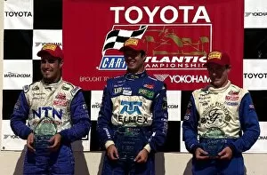 Images Dated 16th June 2002: Jonathan Macri, (l), and Jon Fogarty, (r), flank race winner Luis Diaz at the Portland Toyota