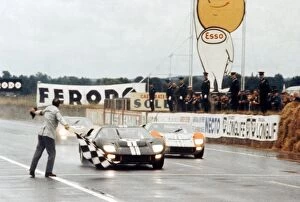 Checkered Gallery: Le Mans 24 Hour Race: Bruce McLaren and Chris Amon Ford GT40 Mk II take the chequered flag to win