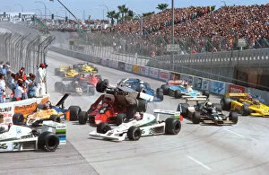 Long Beach, California, USA: Patrick Tambay flies over the back of Niki Laudas at the Hairpin on lap 1