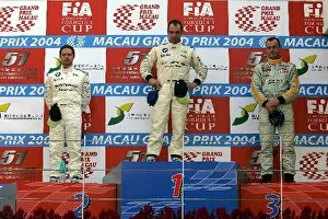 Images Dated 21st November 2004: Macau Guia Touring Cars: Podium L to R: Andy Priaulx BMW Team Germany, Jorg Muller BMW Team Germany