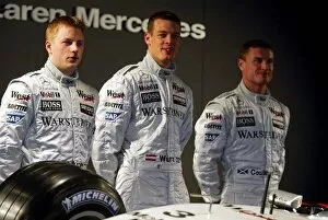 Images Dated 19th January 2002: McLaren F1 Launch 2002: L to R: Kimi Raikkonen, David Coulthard, Alex Wurz
