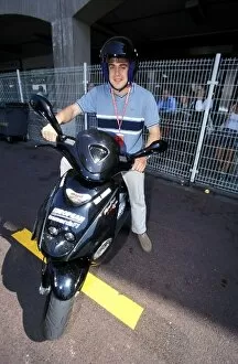 Images Dated 13th May 2003: Monaco Grand Prix: Fernando Alonso with his moped