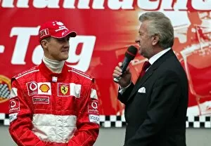Images Dated 7th September 2003: MS Fan-Tag am N├╝rburgring: Manager Willi Weber, right, interviews Michael Schumacher