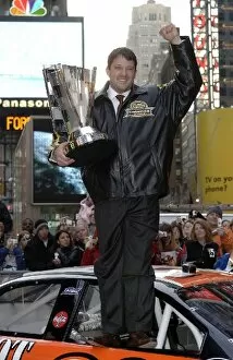 Images Dated 5th December 2005: Nextel Cup Series: Tony Stewart poses with the trophy in Times Square