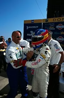 Images Dated 7th July 2005: Open Fortuna Championship: Fernando Alonso, being congratulated by a team member
