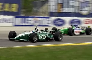 Images Dated 1st June 2002: Paul Tracy (CAN), Honda / Lola, gets under Mario Dominguez in turn three during practice for