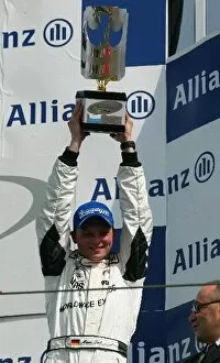 Images Dated 14th April 2002: Porsche Supercup: Third place finisher Marcel Lieb celebrates on the podium