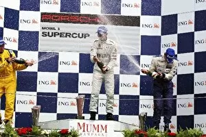 Images Dated 26th July 2009: Porsche Supercup: Podium: Jan Seyffarth Seyffath Motorsport, Race winner Rene Rast