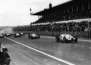 Reims-Gueux, France. 9 July 1939: Tazio Nuvolari and Hermann Muller lead at the start. Muller finished in 1st position